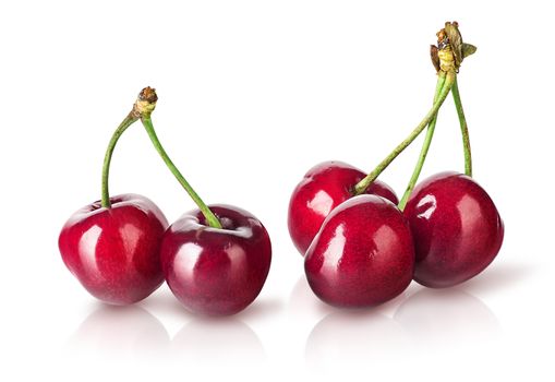 Several perfect sweet cherries isolated on white background