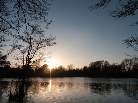 lake surface outside sunset nature landscape background; essex; england; uk