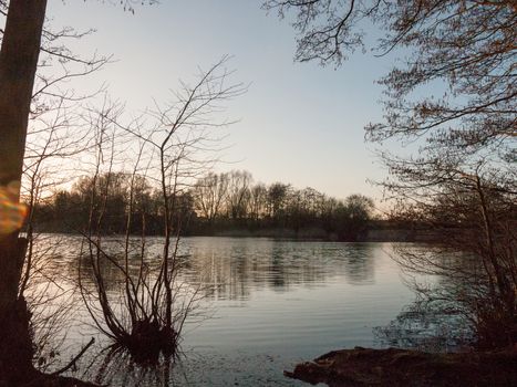 lake surface outside sunset nature landscape background; essex; england; uk