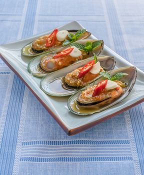 seafood dish with green mussel and  spicy sauce