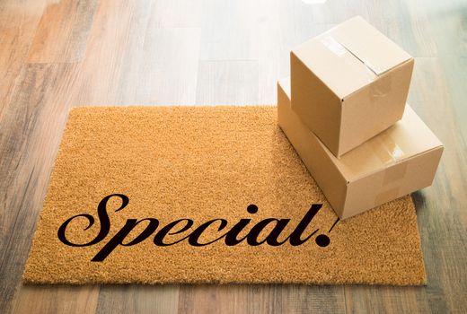 Special Welcome Mat On Wood Floor With Shipment of Boxes.