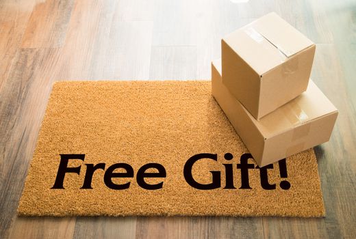 Free Gift Welcome Mat On Wood Floor With Shipment of Boxes.