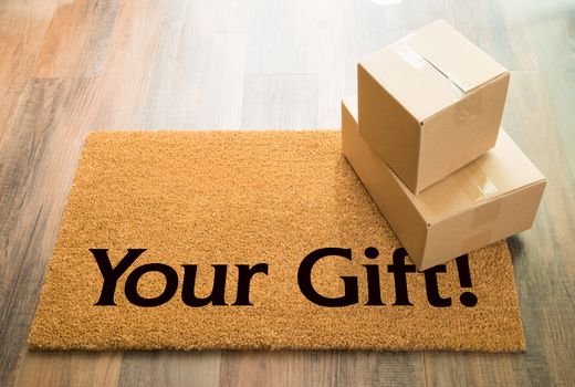 Your Gift Welcome Mat On Wood Floor With Shipment of Boxes.