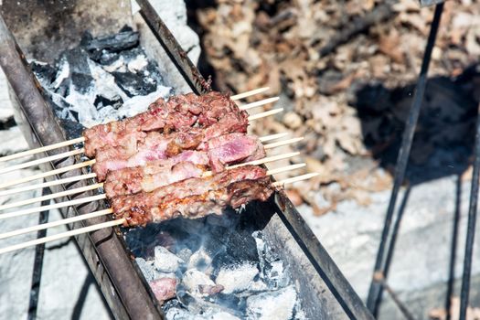 Arrosticini on the grill, Abruzzi skewers of sheep cooked on the grate and on a special brazier.