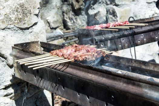 Arrosticini on the grill, Abruzzi skewers of sheep cooked on the grate and on a special brazier.