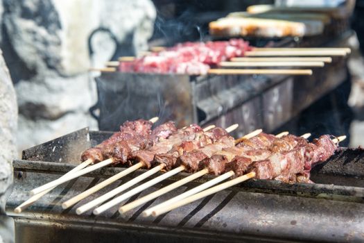 Arrosticini on the grill, Abruzzi skewers of sheep cooked on the grate and on a special brazier.