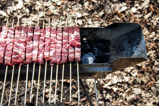 Arrosticini on the grill, Abruzzi skewers of sheep cooked on the grate and on a special brazier.