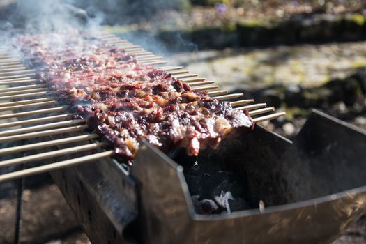 Arrosticini on the grill, Abruzzi skewers of sheep cooked on the grate and on a special brazier.