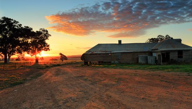 Farm buildings and farm lands as the sun sets