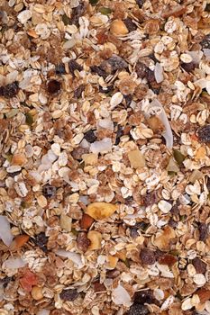 Muesli cereal with seeds, mixed fruit and nuts - as an abstract background texture