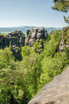 Sandstone rocks, forests and blue sky in the Czech Switzerland