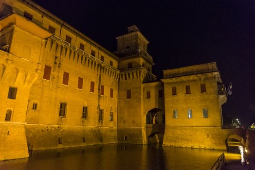 Night view of the Estense castle in Ferrara, Emilia Romagna, Italy