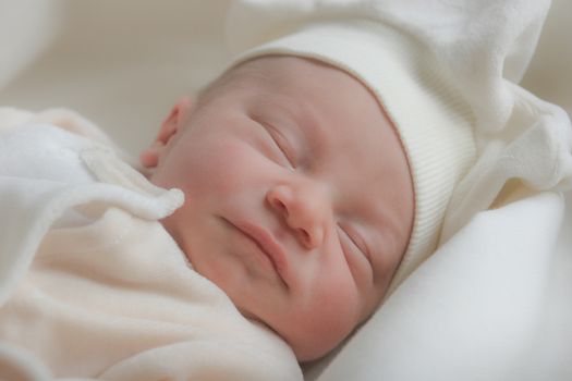 Cute sleeping baby, dressed with soft cotton clothes.