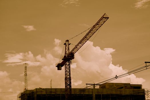 Silhouette construction industry building on high ground sepia style