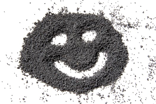 happy face made from dried poppy seeds 