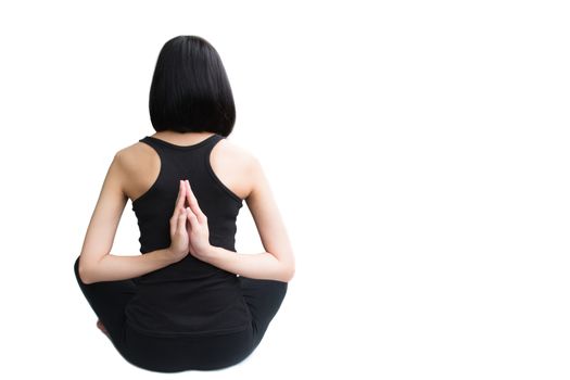 Close-up back of feminine and press the hands together and crossed legs during meditation isolated on white background.