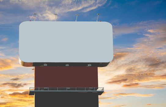 Blank billboard against under the blue with orange cloudy sky