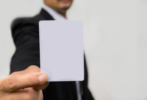 Hand of businessman holding the white card on white background.