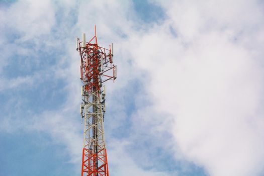 telecommunication mast TV antennas wireless technology under blue sky with cloud