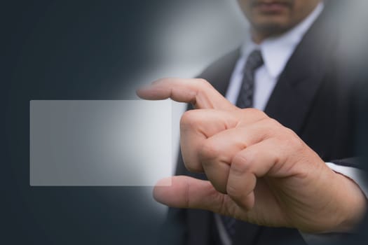 Hand of businessman holding the white card with copy space.