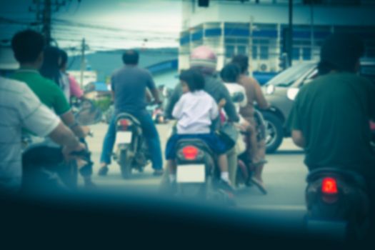 Motorbikes drive waiting for traffic jam. Main road in Bangkok traffic jam with cars and Motorbikes.