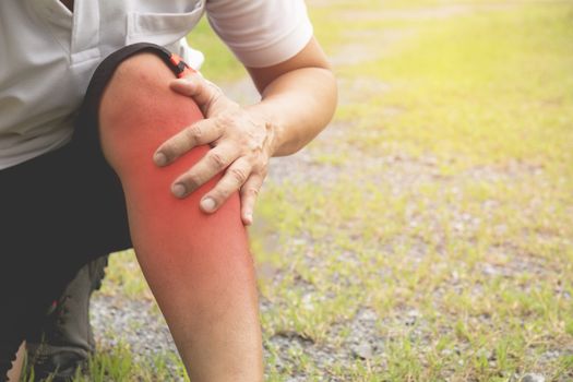 The guy clings to a bad leg. The pain in his leg after exercise. The pain is highlighted in red.