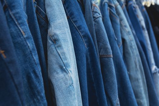 Blue denim jeans background. Blue jeans lined  in market.