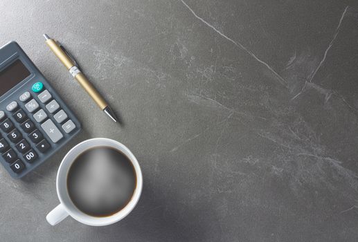 Top view office table coffee with calculator and pen for business and copy space.