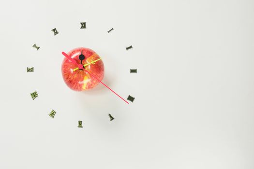 The apple with number of clock, apple shape clock on white background with copy space. 