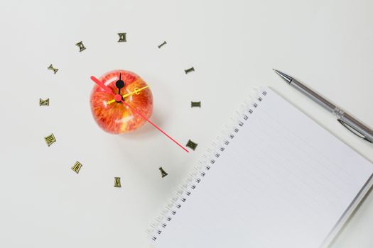 The apple with number of clock, apple shape clock on white background. 