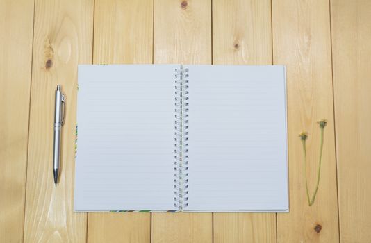 Top view of open book. Book open on wooden table background.