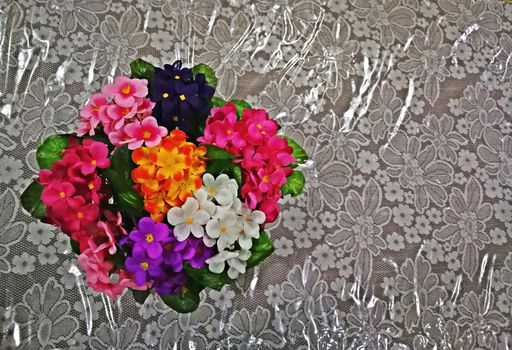 multi color of plastic flowers for decorations on office table