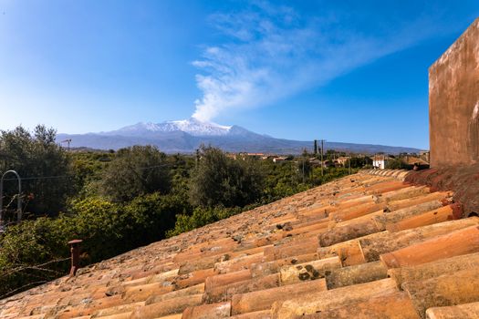 view of the Etna volcano covered by the last spring snow