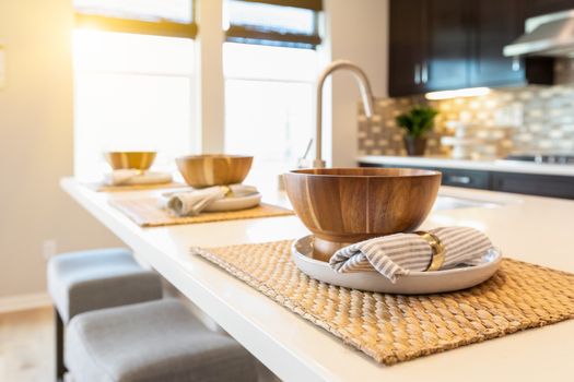 Wooden Bowl Place Settings on Kitchen Island Abstract.