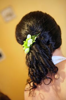 Elegant fashion bridal hairstyle with floral decoration