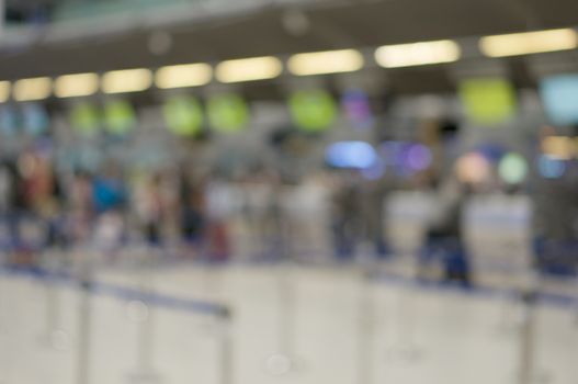 Abstract blurred traveler waiting for check in at airport terminal. Business tourism and rush concept photography.