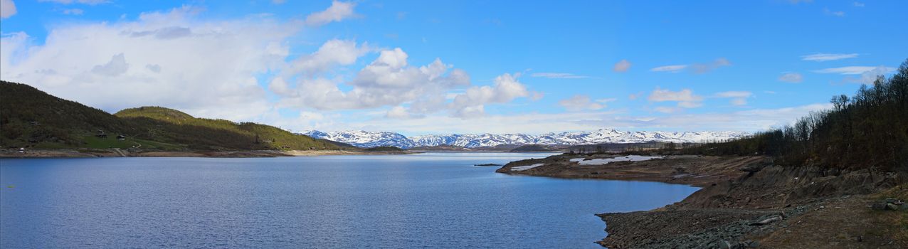 Spring arctic landscape with mountains, lake and tundra, sunny day, Mosvatn, Norway