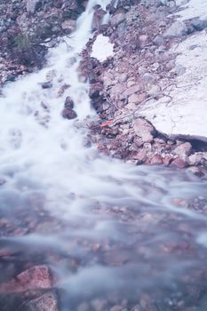 Mountain stream of melting snow water, long exposure