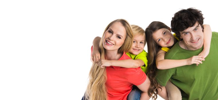 Parents giving piggyback ride to kids, studio isolated on white background