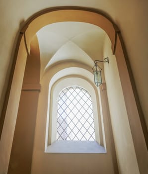 ancient stairwell with architectural arches and ribbed vault