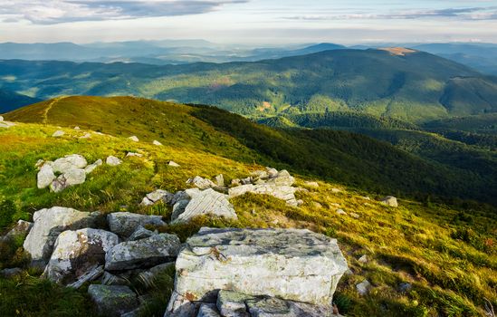 beautiful view of Carpathians in dappled light. wonderful colors of summer landscape in mountains on a cloudy day observed from the top of a hill. location Runa mountain, Ukraine