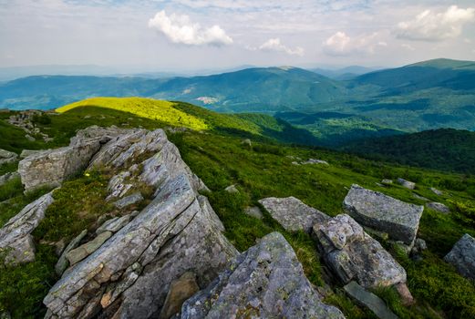 gorgeous view from the Runa mountain. lovely summer landscape with grassy hills in shade of a cloud