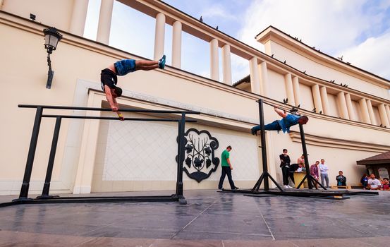 Uzhgorod, Ukraine - Jun 10, 2016: participants of outdoor sports competition. workout championship in Uzhgorod. Young men show their skill on the arena 