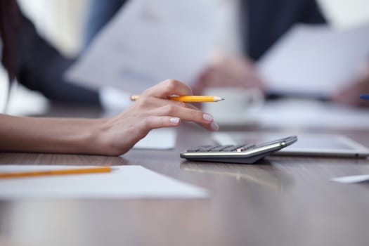 Close-up of Business people working together at meeting