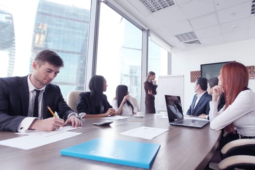 Business presntation on meeting of diverse people around the table