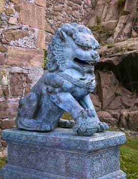 Traditional asian lion sculpture guarding an entrance