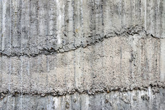 Old concrete gray wall background texture. Building stone construction