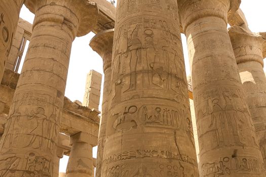 Egyptian hieroglyphs and drawings on the walls and columns. Egyptian language, The life of ancient gods and people in hieroglyphics and drawings