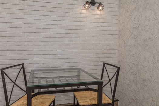 Table for two in apartment with loft style interior 
