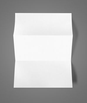 Blank folded White A4 paper sheet mockup template isolated on dark grey background